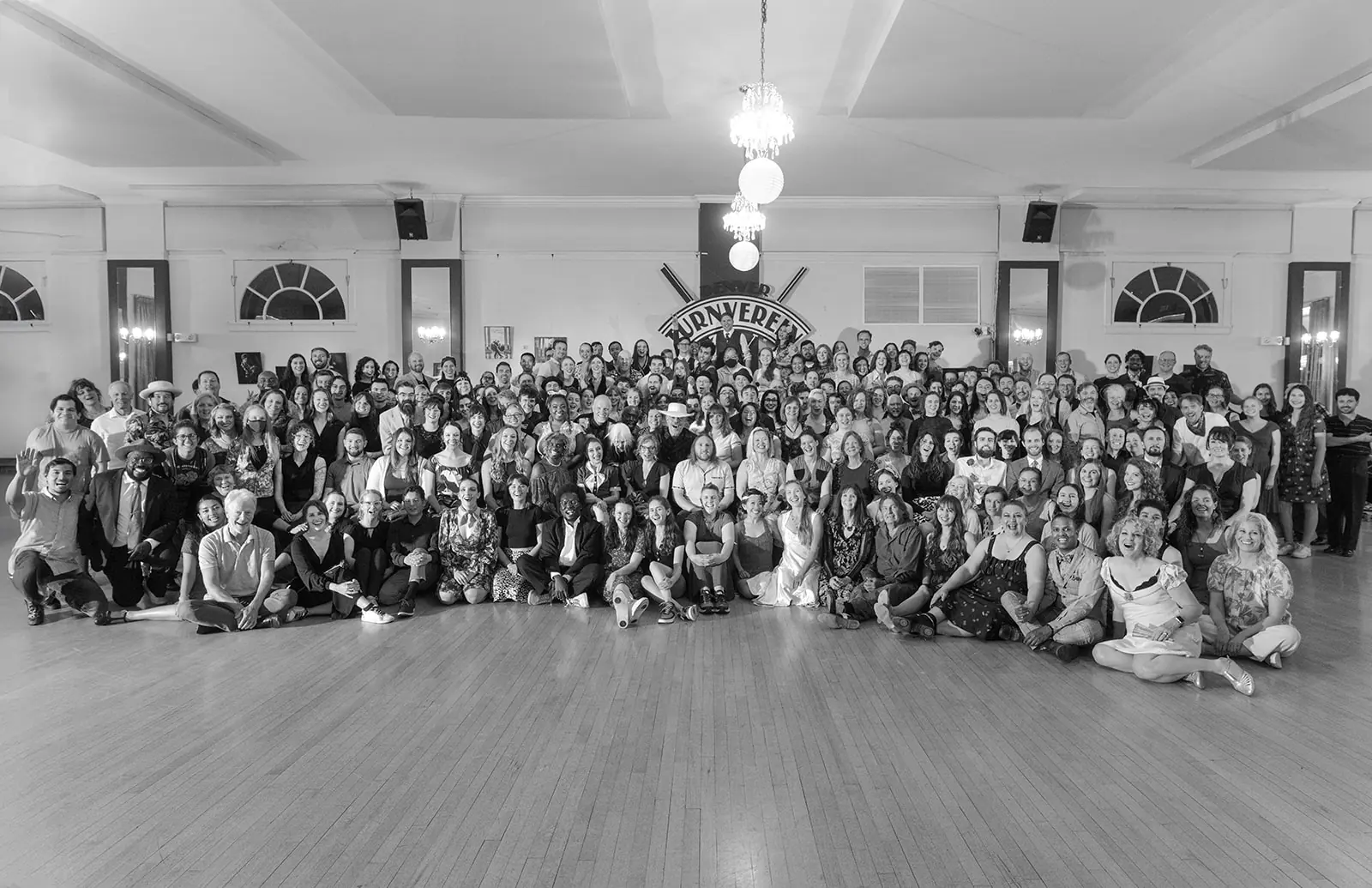 Hundreds of swing dancers gathered for a group photo on the Denver Turnverein dance floor
